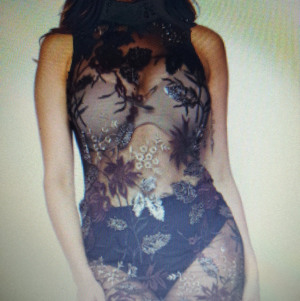 Burgundy sleeveless dress.